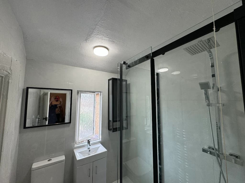 Modern bathroom shower installation with glass enclosure - Shower fitting Carshalton