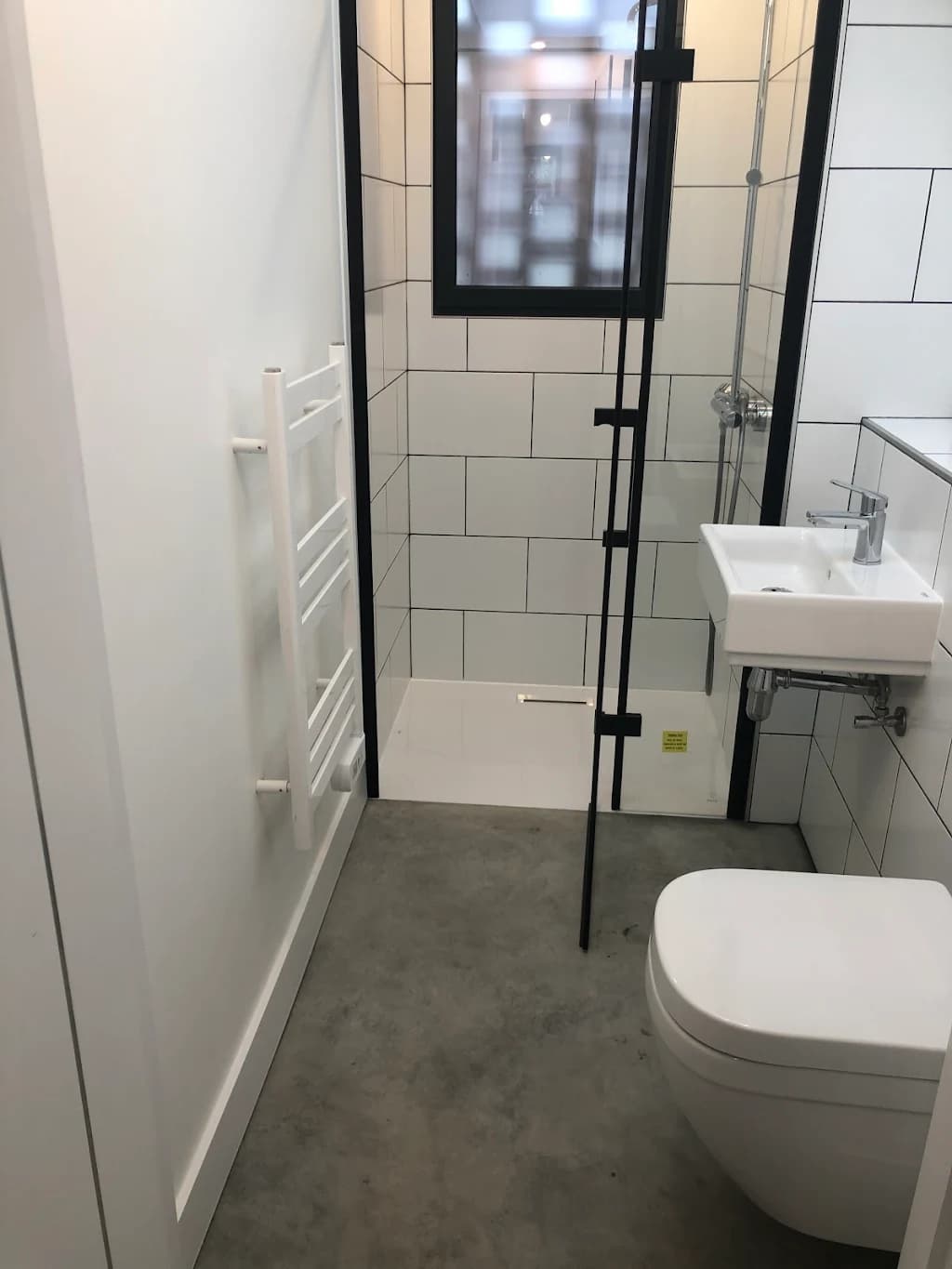 Small bathroom design with black frame shower enclosure - Compact bathroom specialists Morden